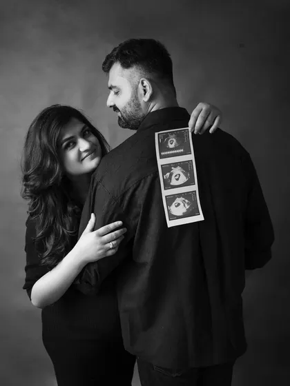 A creative and timeless black and white portrait using a sonogram strip. It's a sweet and personal way to announce your pregnancy and celebrate the life you've created together.
