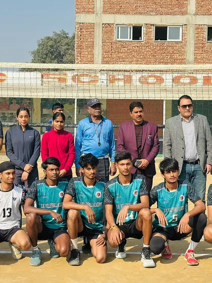 Our boys' team standing together with coaches and officials. This photo represents the discipline and unity we foster within our academy.
