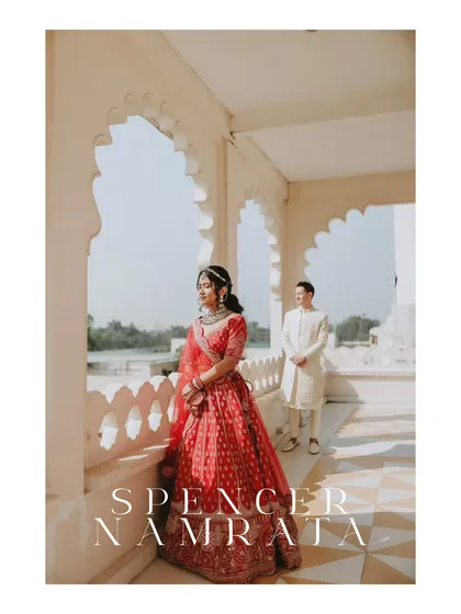 A regal portrait of the couple at a palace, with the bride in a stunning red lehenga. This shot showcases our ability to create elegant, magazine-worthy images.