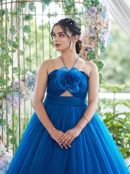 This is 'Venessa', a versatile royal blue gown. It features a sweetheart halter-neck top with a waist cutout and a full tulle skirt.