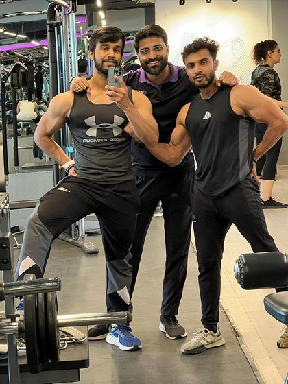 In the gym with my training partners. We all share a passion for building an aesthetic physique through hard work.