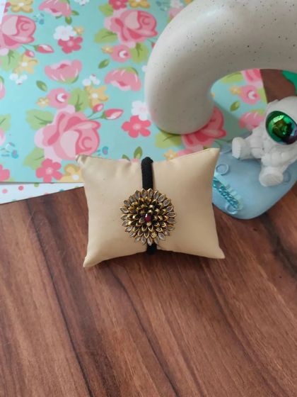 My collection of decorative elastic hair bands. Each one features a unique handmade centerpiece, including gotapatti, Kundan work, zardozi, and bead embroidery.