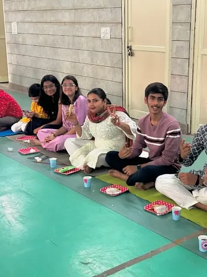 We are more than just a club; we are a fencing family. Here is our team sharing a meal together during our Diwali celebration. We believe in training hard together and supporting each other like family.