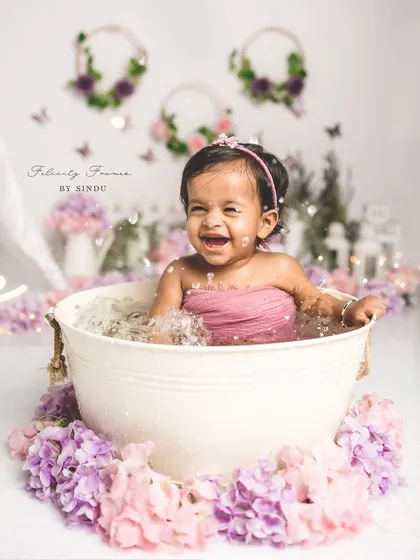 A big, happy splash! The tub session after the cake smash is always a highlight, full of fun and laughter.
