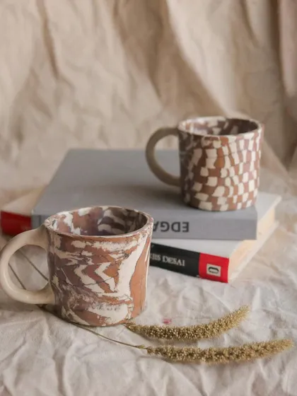 The 'Check / Uncheck' Nerikomi cup set. These little cups are perfect for an espresso shot or a cutting chai. I created the patterns by layering and slicing different colored clays.