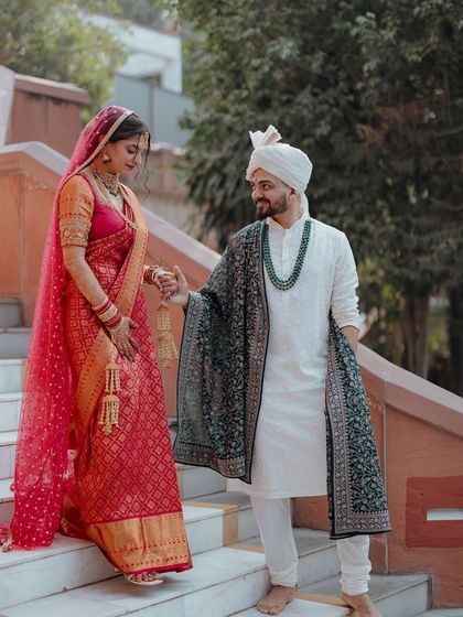 A simple and elegant court marriage, where the couple descends the stairs hand-in-hand, ready to start their new life together.