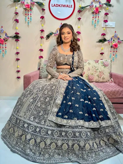 A full-length shot of the bride in her magnificent Sangeet outfit. The makeup is bold enough to stand out and complement the grandeur of the lehenga.