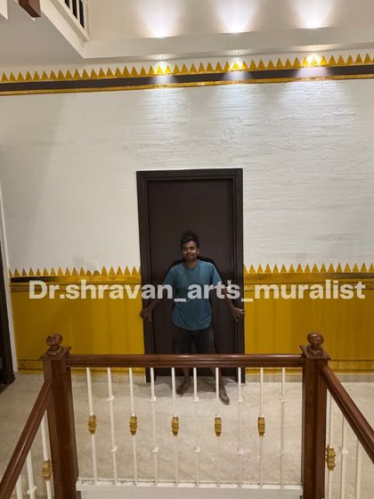 Here I am with a finished Chettinad-inspired border. The sharp geometric patterns in yellow and gold against a textured white wall bring a touch of traditional minimalism to this hallway.