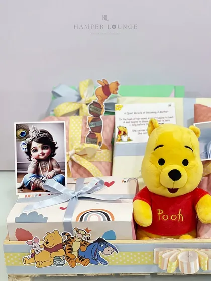 This Pooh-themed hamper for an expecting mother also includes a beautiful image of little Krishna, blending classic characters with cultural blessings for the new baby.