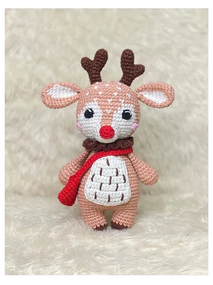 I made this little reindeer as a custom order, and it's just so festive and cute. I paid special attention to the details, from its red scarf to the tiny spots on its back.