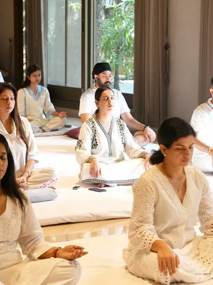 A diverse group of students meditating together. This practice is for everyone, and our community reflects that.