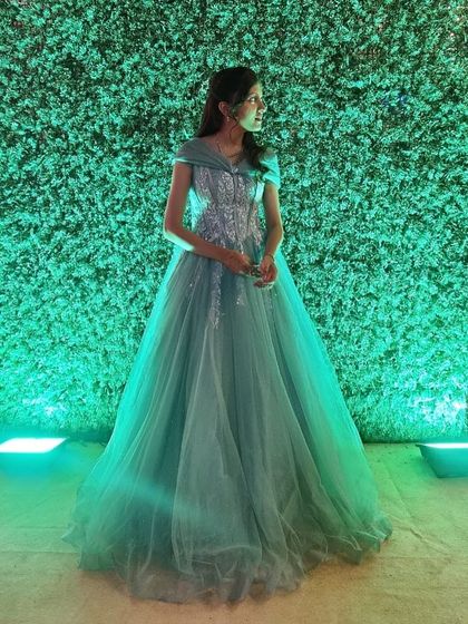 A dreamy, ethereal look. This pastel green gown with a sparkling bodice is perfect for a fairytale-themed engagement or reception.