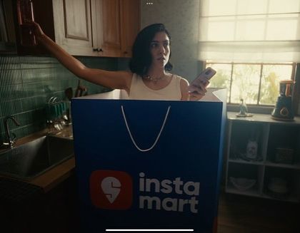 A surreal and funny shot from the Swiggy ad. I styled the actress in a simple tank top and jeans, a very relatable outfit for being at home, which makes the giant Instamart bag even funnier.
