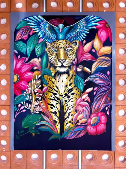 A powerful leopard mural, also painted for the Uttarakhand project. Surrounded by vibrant, tropical foliage, this piece brings the untamed spirit of the wild indoors.