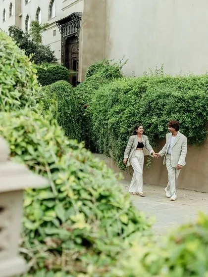 A candid moment as the couple walks hand-in-hand through the lush green pathways of the Fairmont hotel. This shot shows how we can find beautiful, natural settings even within a grand palace location.
