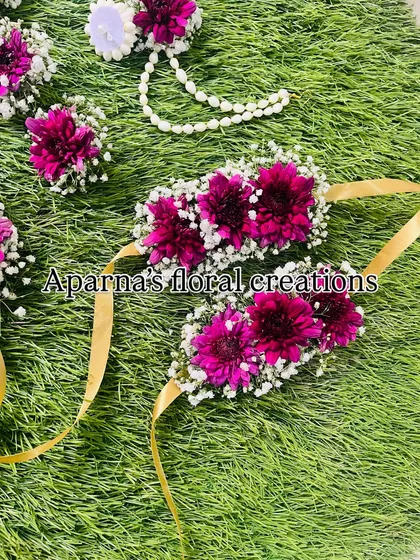 The bajuband (armlets) from the magenta set, designed with gold ribbons for tying.