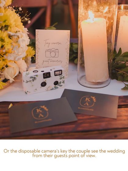Disposable cameras were placed on tables for guests to capture the wedding from their point of view. This fun idea gives the couple a collection of candid, unfiltered memories from their special day.