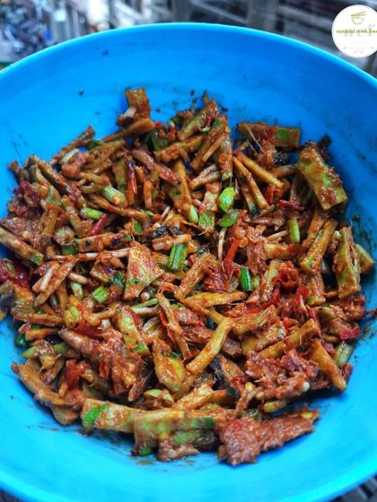 A bowl of freshly made Yongchak Singju. The stink beans have a strong, unique flavor that is beloved in Manipuri cuisine.