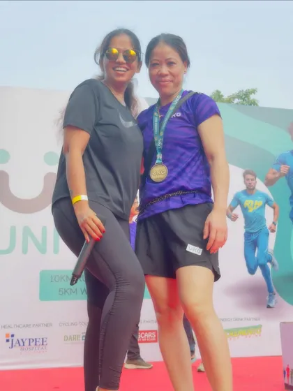 Another proud moment on stage with world champion Mary Kom. These images serve as powerful testimonials to the high-profile nature of the events I curate.