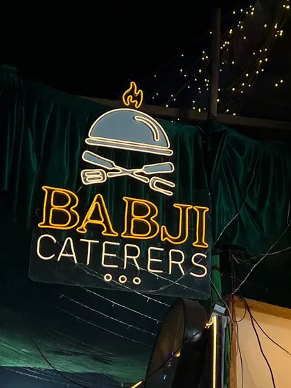 Our neon sign glowing brightly, welcoming guests to our Ramadan feast. The festive lights and the aroma of good food create a magical atmosphere.