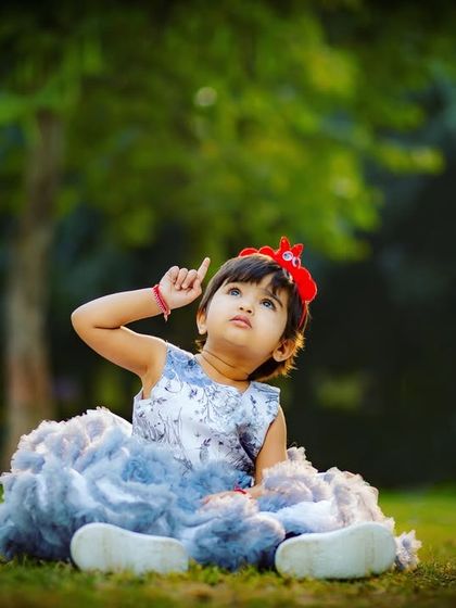 A thoughtful portrait of Aradhya during her outdoor milestone session. I aim to capture a range of expressions, from bright smiles to these sweet, curious looks.