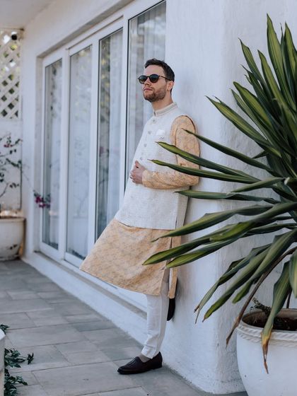 A collection of portraits from a beautiful Haldi photoshoot. I coordinate with the photo team to capture a variety of shots, from romantic close-ups and playful kisses to stylish individual portraits, all within a cohesive, sun-drenched theme.