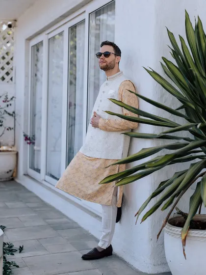 A collection of portraits from a beautiful Haldi photoshoot. I coordinate with the photo team to capture a variety of shots, from romantic close-ups and playful kisses to stylish individual portraits, all within a cohesive, sun-drenched theme.