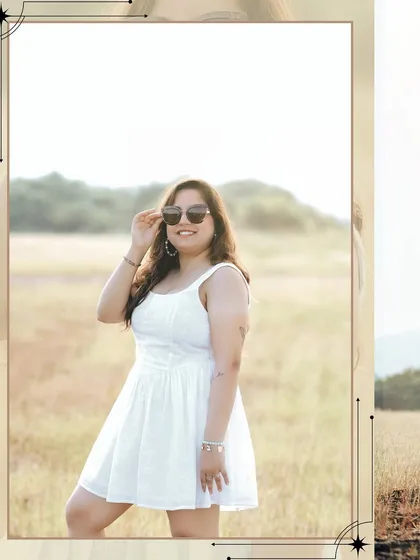 A beautiful solo portrait of the bride-to-be, glowing in the golden light of a Goan field.