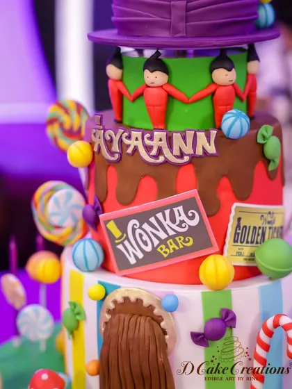 A close-up of our whimsical Willy Wonka and the Chocolate Factory cake. This shot highlights the edible lollipops, Wonka bar, and Oompa Loompas that bring this delicious world to life.