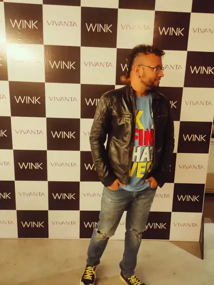 A full-length shot of me at an event, showing my stage presence and style. The right look is part of the performance.
