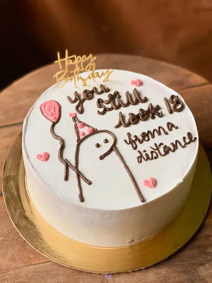 A funny birthday cake that says "you still look 18 from a distance".
