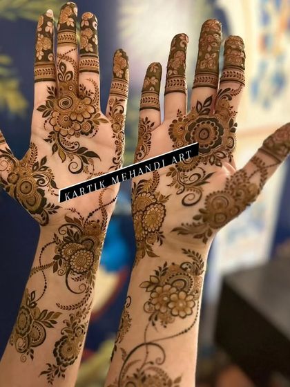 An angled view of the Arabic floral design, showing how the pattern elegantly wraps around the hands and fingers.