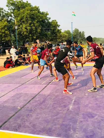 A tense moment during a match on the mat. Our defenders get into formation, ready to counter the opponent's raid with a coordinated team effort.