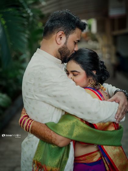 A comforting and emotional hug shared between the couple. This photo captures a moment of quiet support and deep affection on their engagement day.