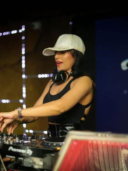 A focused shot of me at the decks during a Friendship Day event. Even while concentrating, I bring a relaxed and happy energy.