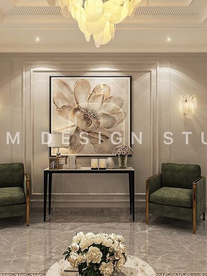 Symmetrical design is a hallmark of neoclassical style. Here, two green armchairs frame a console table and a large floral art piece, creating a balanced and elegant seating vignette.