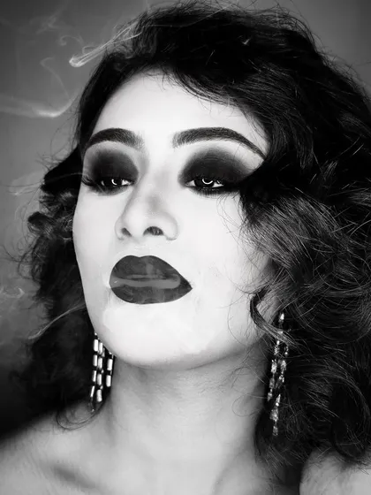 There is a unique power in monochrome. This black and white look plays with smoke and shadow to create a dramatic, high-fashion effect, proving that true glamour doesn't always need color.