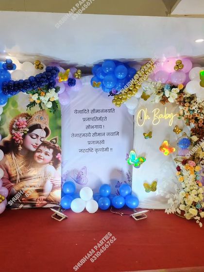 A full view of the Krishna-themed "Oh Baby" stage decoration with extensive balloon work.