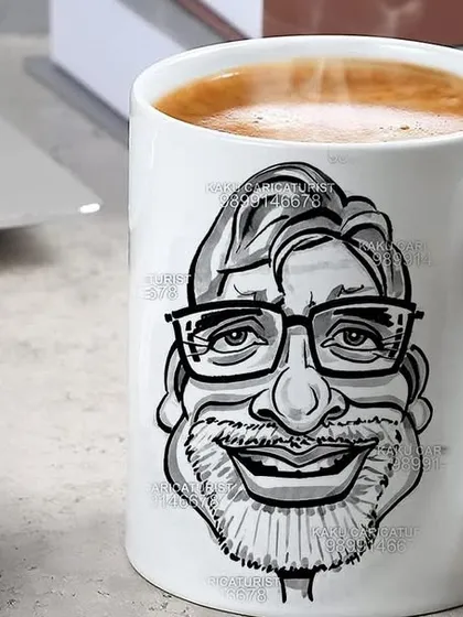 Your face on a mug. I can create these custom caricature coffee mugs live at your event. It's a unique and practical party favor or corporate gift that people will actually use and remember.