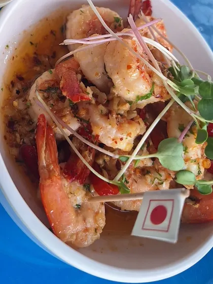 A plate of delicious garlic butter prawns, a must-have when dining by the sea in Goa.