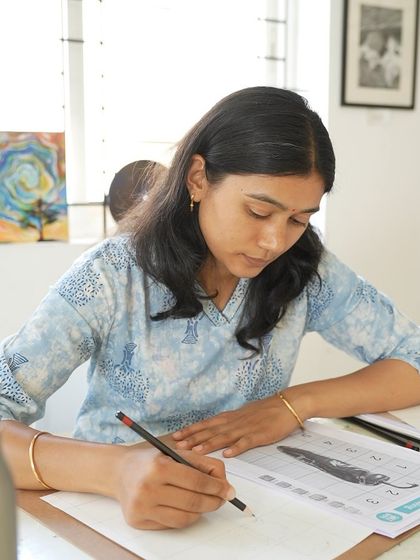 A student practices sketching techniques during our CFA weekday batch. Consistent practice is key to artistic growth.