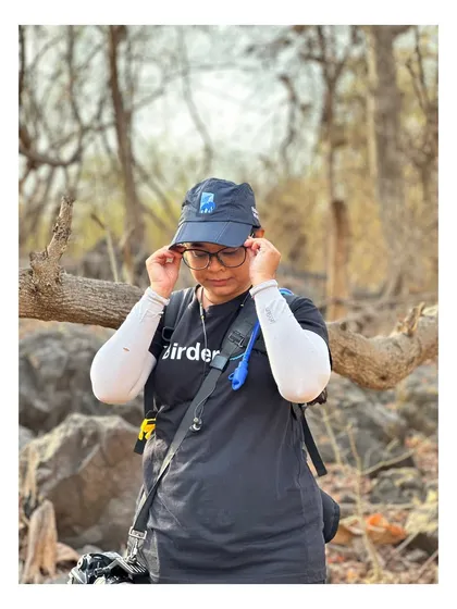 Adjusting my glasses, a real-life moment between shots. It's a reminder that behind the epic wildlife photos, there's a person dealing with everyday things.