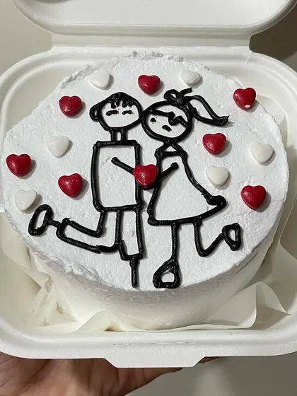 A cute bento cake for Valentine's Day or an anniversary, featuring a hand-drawn couple and a secret message inside.