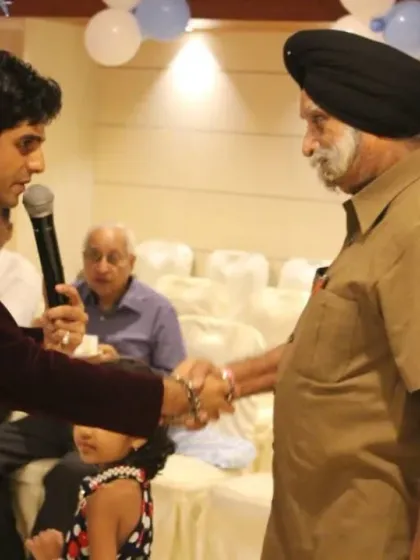 A heartfelt moment interacting with an elderly guest who loved the show. My goal as an emcee is to connect with the audience personally, making everyone feel welcome and entertained.