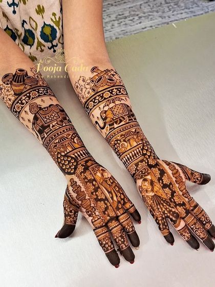 A full view of a bridal design that combines figure work on the palms with traditional motifs like elephants and musical instruments on the arms.