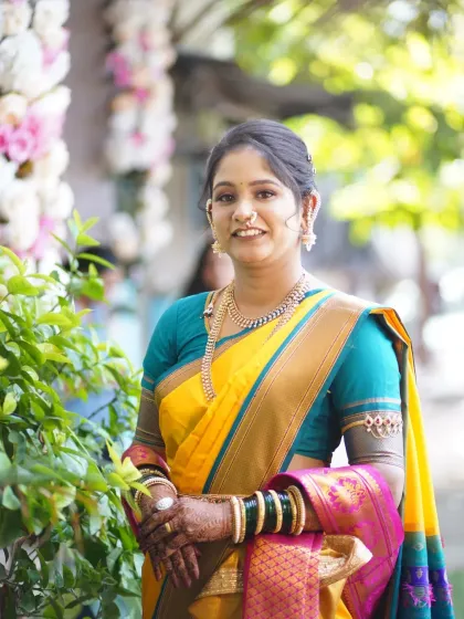 A Punyawachan look in a classic yellow saree. The makeup is kept minimal and fresh, with a simple hairstyle to match the occasion.