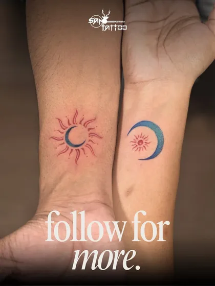 A beautiful couple tattoo for a 10th anniversary. One wrist has a sun with a moon inside, the other has a moon with a sun inside, symbolizing how they complete each other.