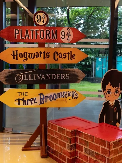 Another shot of the iconic signpost to Hogwarts and other magical locations, a key piece of decor for setting the scene.
