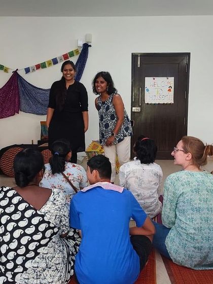Two members of our team share a happy moment during a workshop with Snehadhara Foundation. The collaborative energy makes these sessions special for us as well.