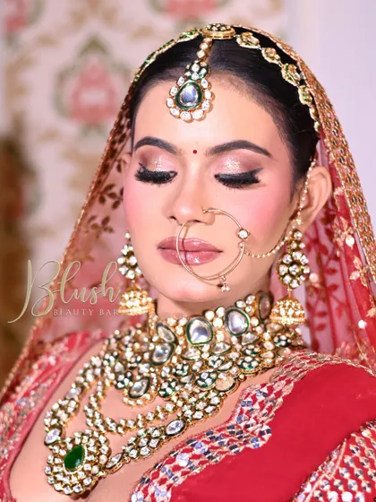 A close-up of a student's bridal creation. The eye makeup is perfectly executed, with a sharp winged liner and beautifully blended shadows.